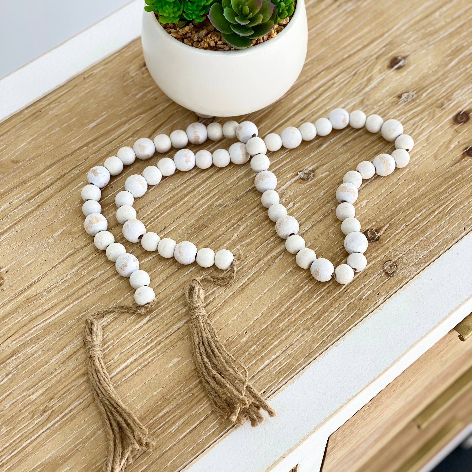 Wooden White Wash Bead Garland With Tassels
